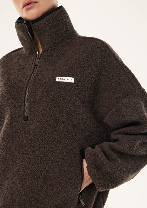 Rotate quarter zip
